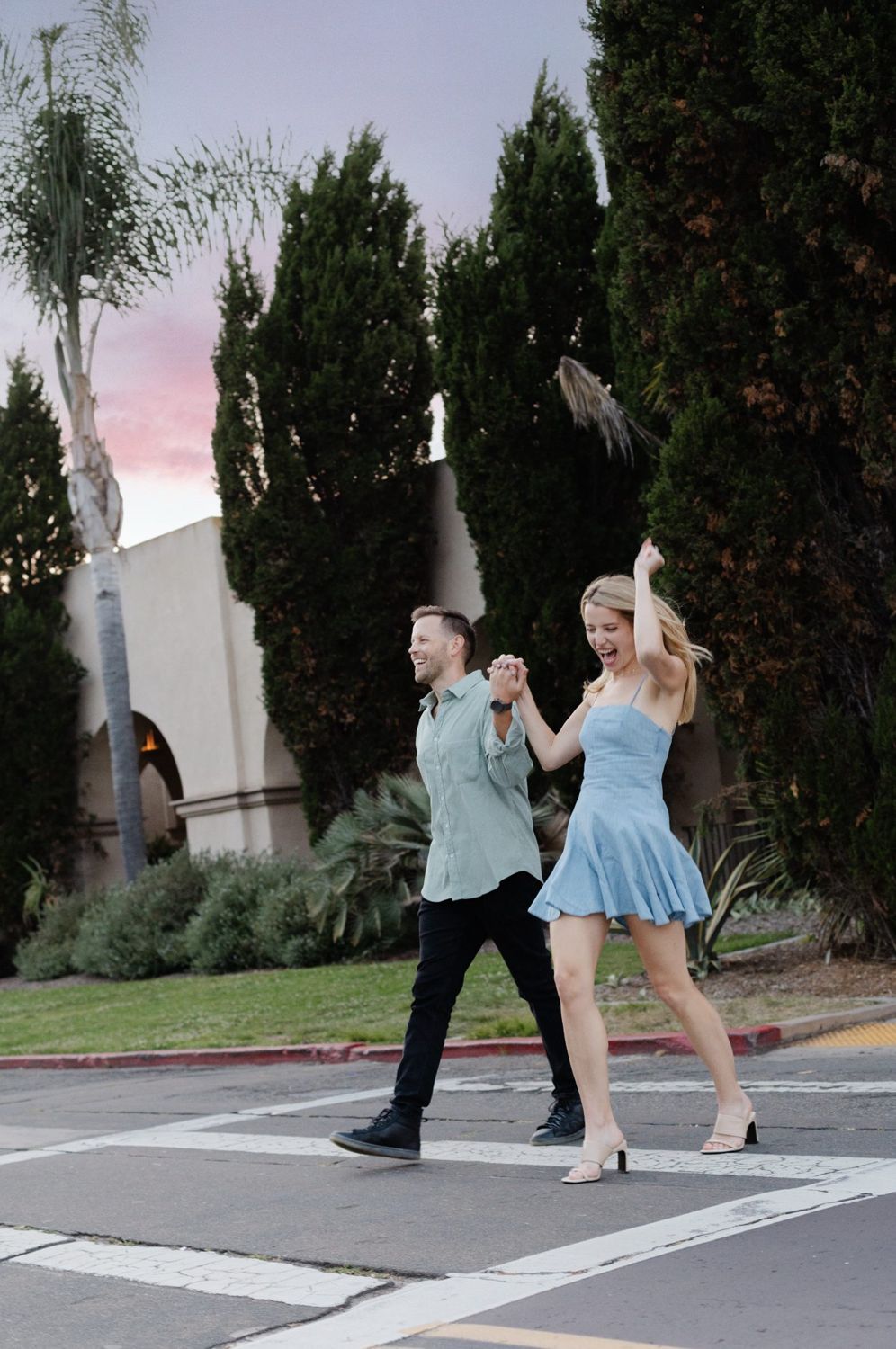 Annie and Serik celebrating in a crosswalk